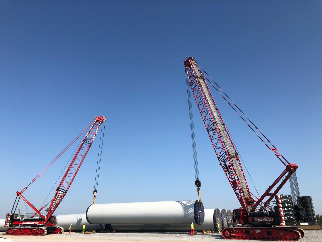 Crawler cranes installing wind turbine components at a southern Ukraine wind farm