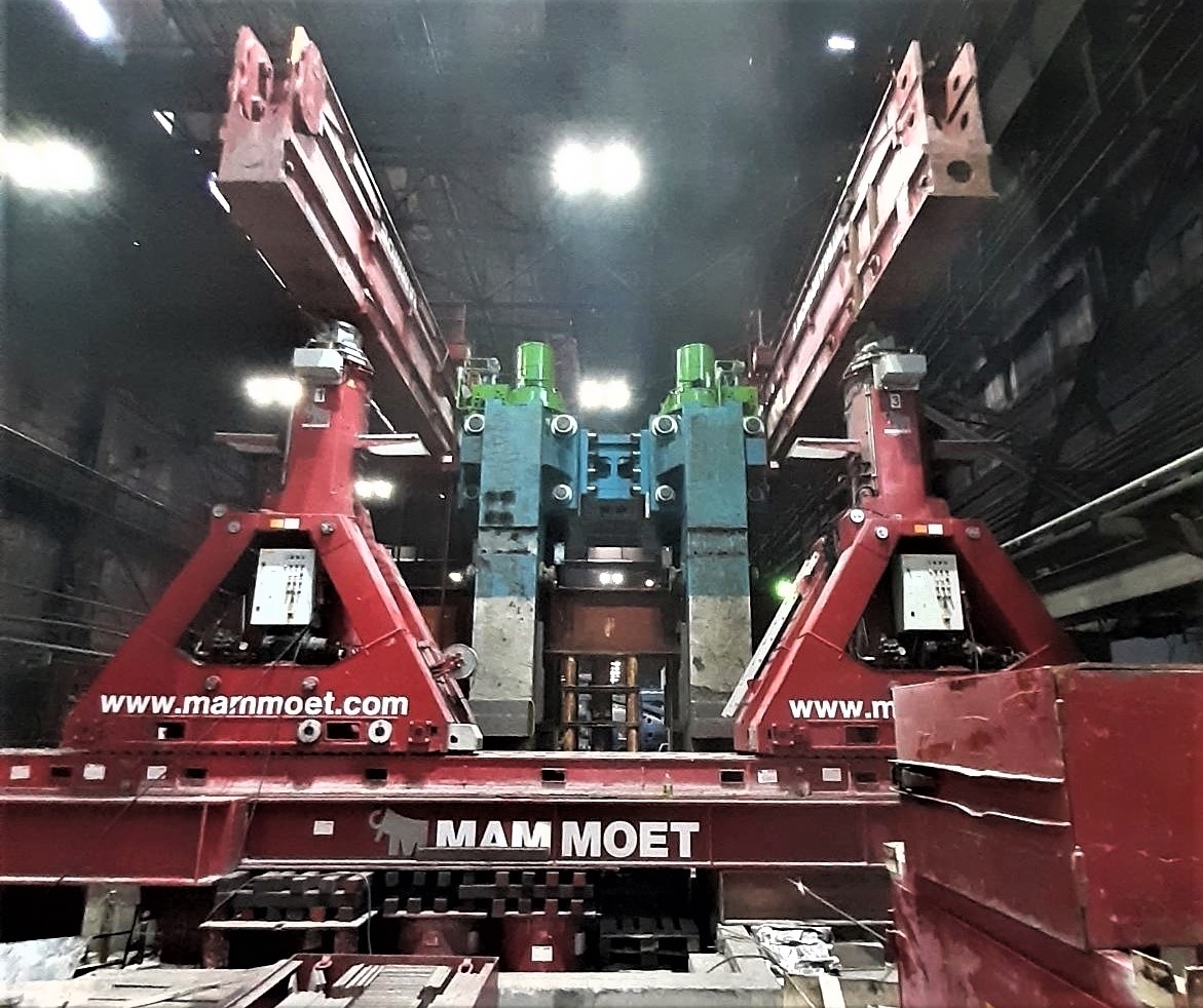 Hydraulic gantry equipment installing machinery at a steel plant
